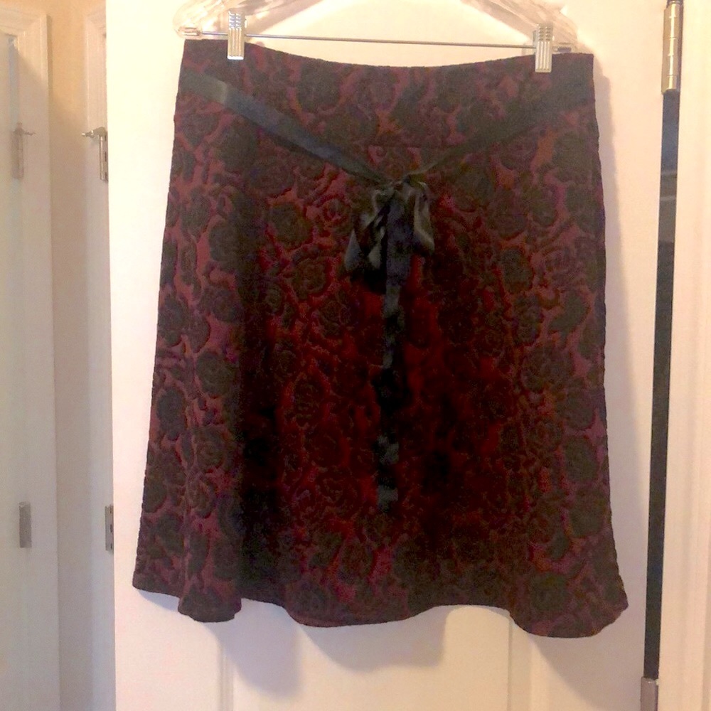 Fit and flare skirt with ribbon belt.